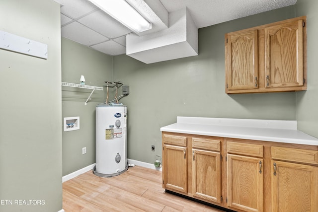 221 Woodland Rd Unit 315, Gatlinburg, TN 37738 - laundry room with washer hookup, light wood-style floors, electric water heater, hookup for an electric dryer, and cabinet space