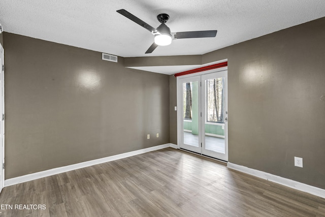 221 Woodland Rd Unit 315, Gatlinburg, TN 37738 - empty room with baseboards, a textured ceiling, a ceiling fan, visible vents, and wood finished floors