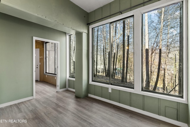 221 Woodland Rd Unit 315, Gatlinburg, TN 37738 - spare room featuring baseboards, plenty of natural light, and wood finished floors