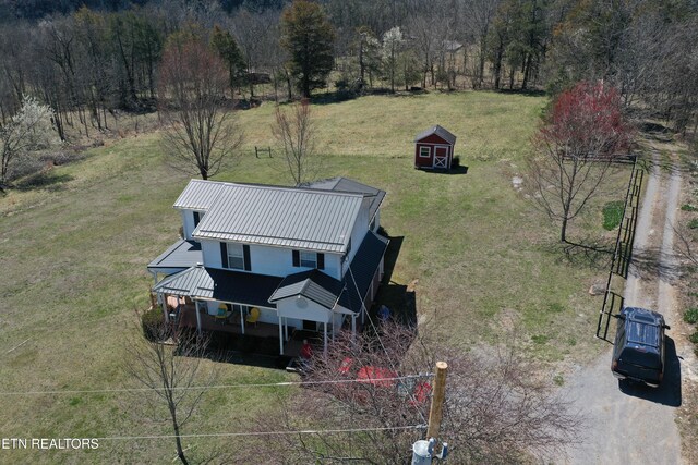 drone / aerial view featuring a view of trees