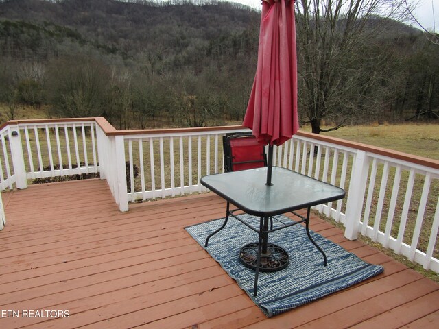 wooden deck featuring a wooded view