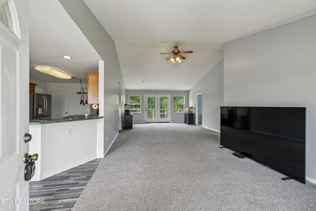 4720 Scenic Point Dr, Louisville, TN 37777 - unfurnished living room with baseboards, a ceiling fan, lofted ceiling, and dark colored carpet