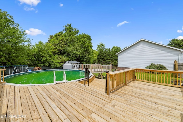 4720 Scenic Point Dr, Louisville, TN 37777 - wooden terrace with an outdoor pool and view of wooded area