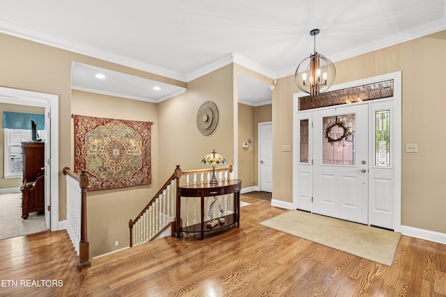 144 Nunyu Trl, Vonore, TN 37885 - foyer with a chandelier, baseboards, wood finished floors, recessed lighting, and crown molding