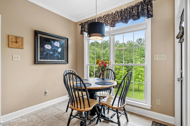 144 Nunyu Trl, Vonore, TN 37885 - dining area featuring baseboards, light tile patterned floors, ornamental molding, and plenty of natural light