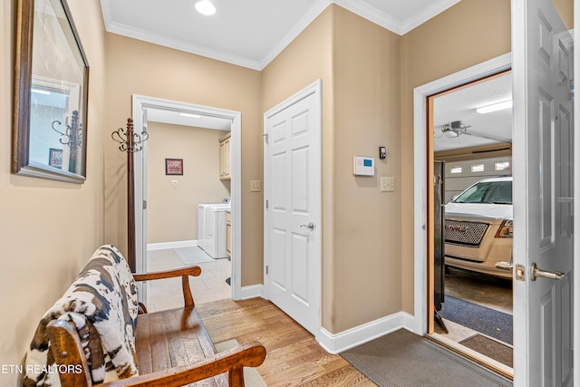144 Nunyu Trl, Vonore, TN 37885 - entryway with washing machine and dryer, light wood-type flooring, crown molding, baseboards, and ceiling fan
