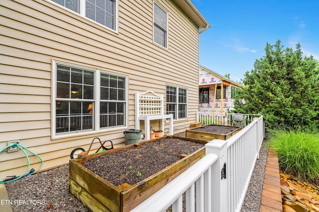 144 Nunyu Trl, Vonore, TN 37885 - wooden terrace featuring a vegetable garden