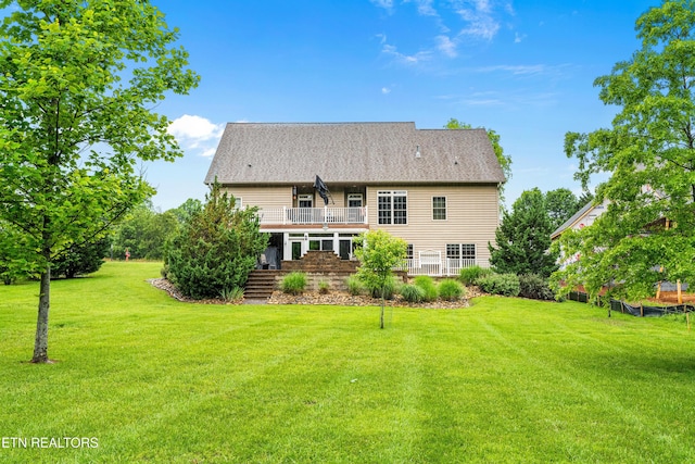 144 Nunyu Trl, Vonore, TN 37885 - rear view of property with a balcony and a lawn