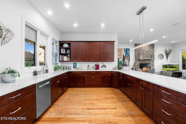 480 Indian Cave Dr, Loudon, TN 37774 - kitchen with stainless steel dishwasher, a sink, light countertops, light wood-type flooring, and recessed lighting