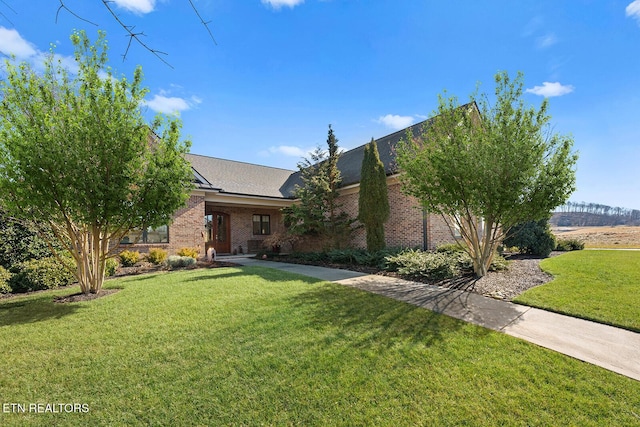480 Indian Cave Dr, Loudon, TN 37774 - view of property hidden behind natural elements with a front lawn and brick siding
