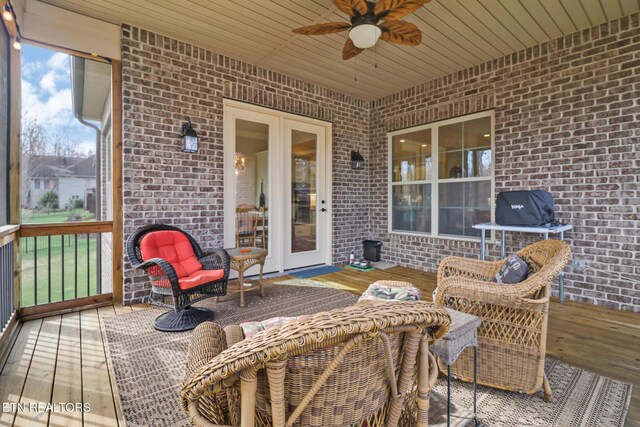 deck featuring french doors and a ceiling fan
