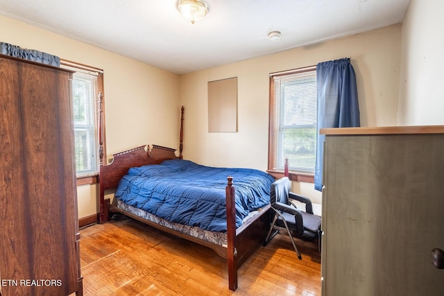 bedroom with light wood-style floors