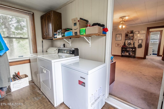 laundry room with washing machine and dryer and cabinet space