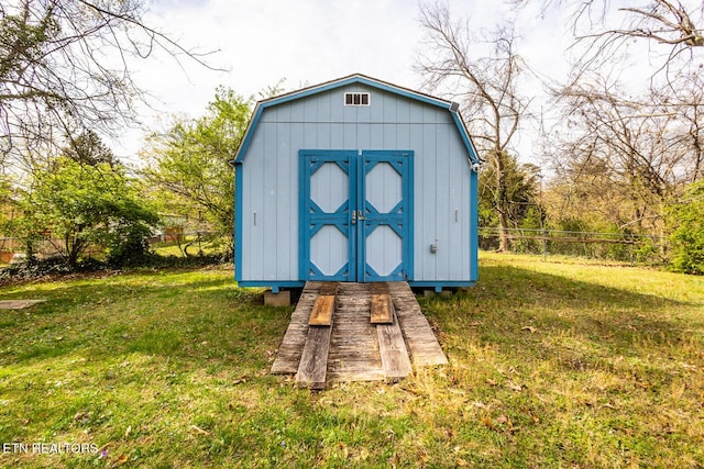 view of shed with fence