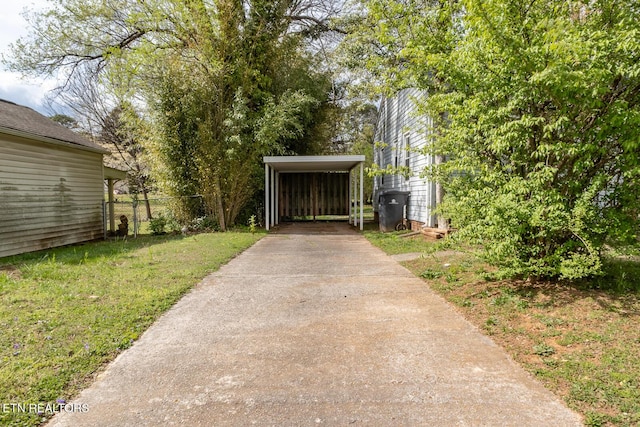 exterior space with driveway and fence