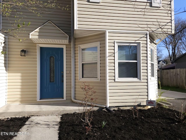 property entrance with fence