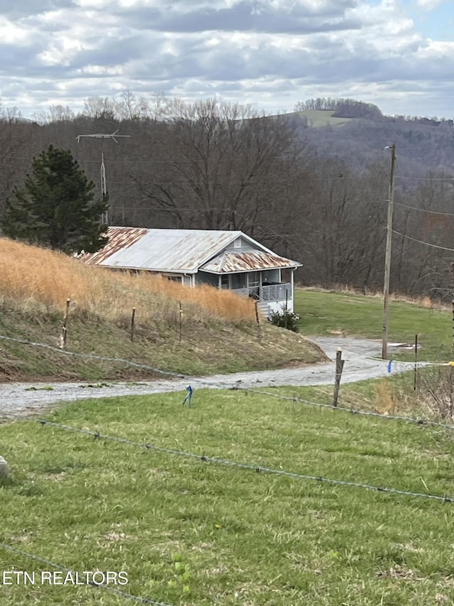 view of yard with a wooded view