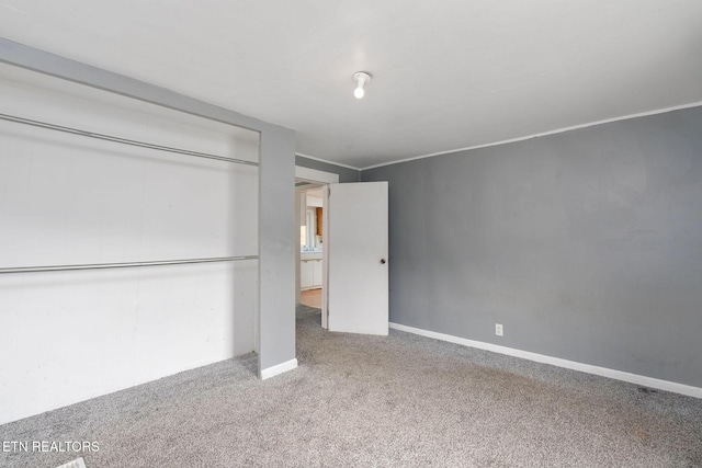 869 Poplar Grove Rd, Harrogate, TN 37752 - unfurnished bedroom with carpet flooring, a closet, and baseboards