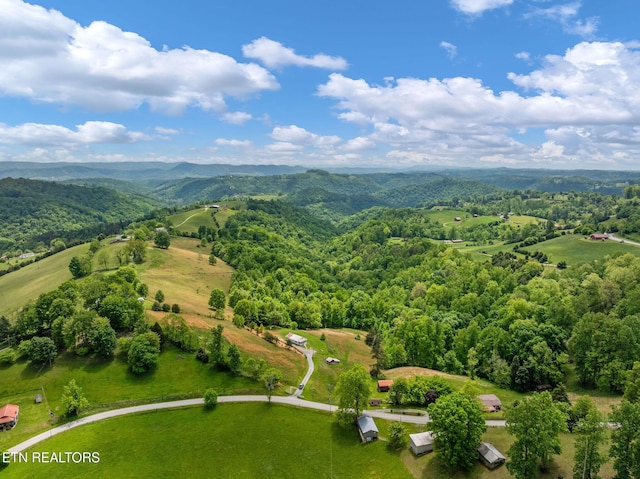 869 Poplar Grove Rd, Harrogate, TN 37752 - drone / aerial view of a heavily wooded area and a mountainous background