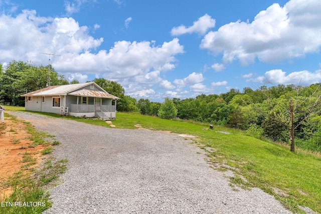 869 Poplar Grove Rd, Harrogate, TN 37752 - view of front of property featuring gravel driveway and a porch