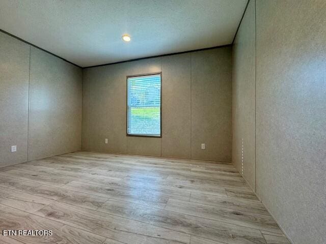 unfurnished room featuring light wood-style flooring
