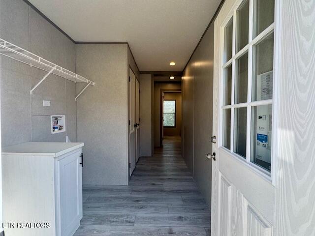 exterior space with laundry area, light wood-style floors, and hookup for a washing machine