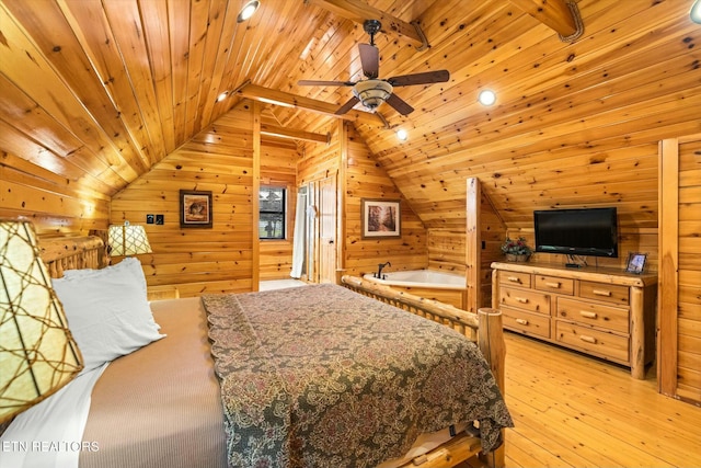 bedroom featuring light wood-style flooring, vaulted ceiling, wooden ceiling, and wood walls