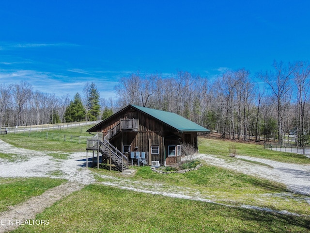 145 Horse Haven Rd, Allardt, TN 38504 - view of outdoor structure with a wooded view, fence, and stairway