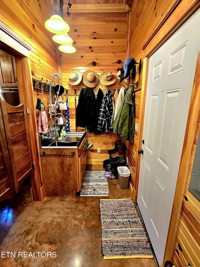 145 Horse Haven Rd, Allardt, TN 38504 - mudroom with a sink, wood walls, and finished concrete floors