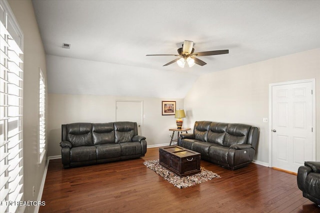 living area featuring visible vents, baseboards, ceiling fan, lofted ceiling, and hardwood / wood-style floors