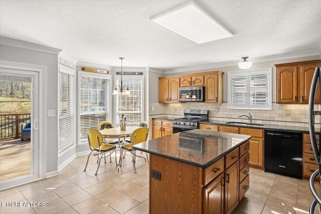 kitchen with a sink, appliances with stainless steel finishes, crown molding, and decorative backsplash