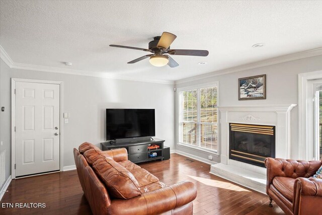 living room with hardwood / wood-style floors and crown molding