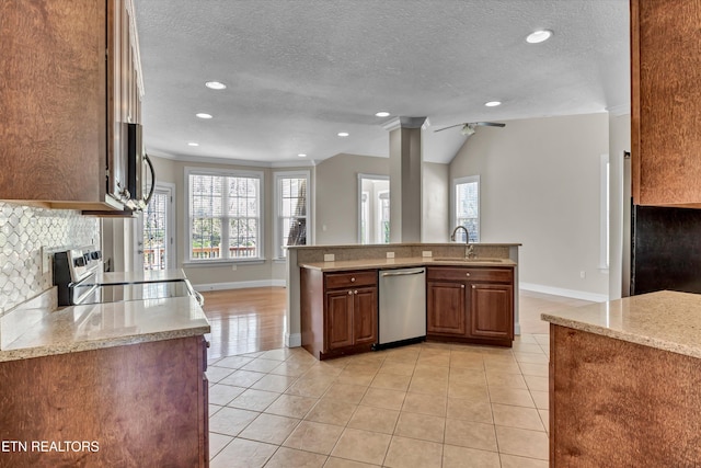 kitchen featuring light tile patterned flooring, a sink, dishwasher, and electric range oven