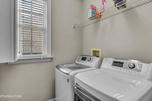 laundry area with independent washer and dryer, laundry area, and plenty of natural light