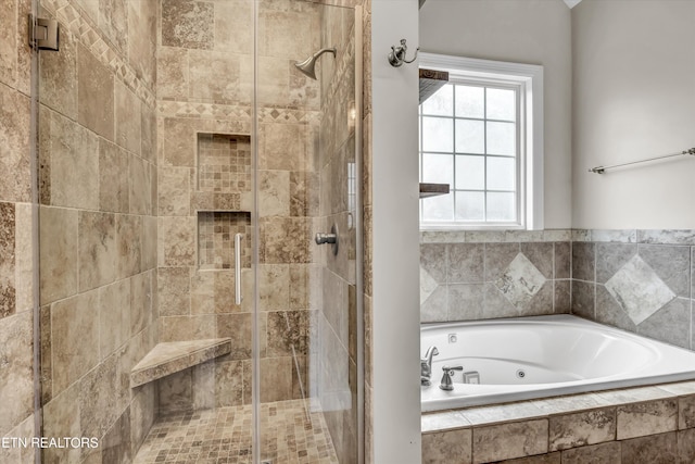 full bathroom with a tub with jets and a stall shower
