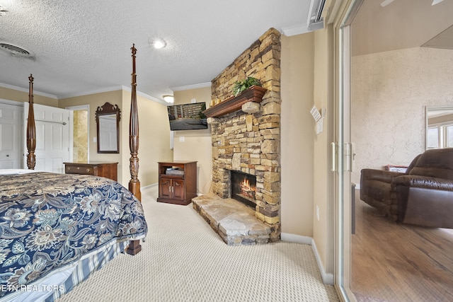 102 Baskins Creek Byp Unit 604, Gatlinburg, TN 37738 - bedroom with a fireplace, a textured ceiling, visible vents, and crown molding