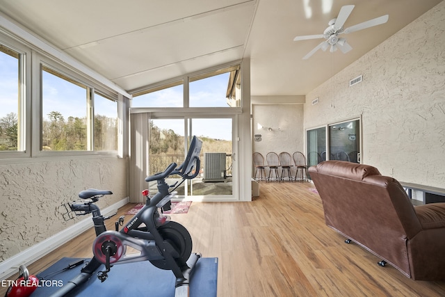 102 Baskins Creek Byp Unit 604, Gatlinburg, TN 37738 - workout room featuring vaulted ceiling, a textured wall, ceiling fan, visible vents, and wood finished floors