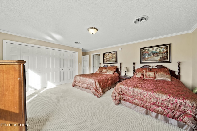 102 Baskins Creek Byp Unit 604, Gatlinburg, TN 37738 - bedroom featuring crown molding, carpet flooring, a textured ceiling, visible vents, and a closet