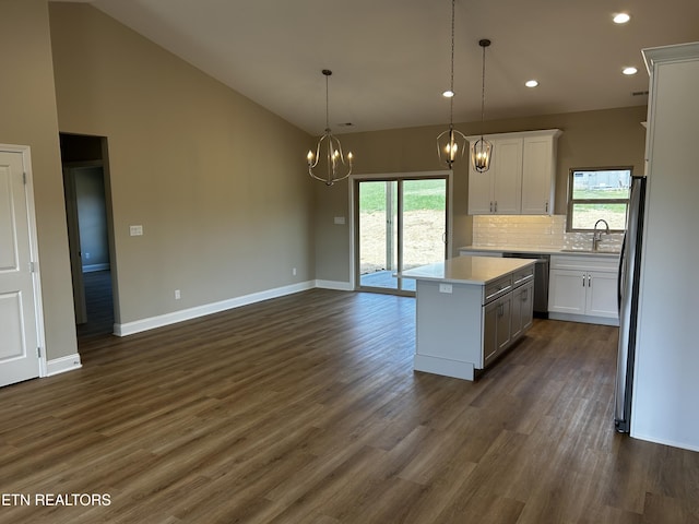 kitchen featuring light countertops, white cabinetry, recessed lighting, stainless steel appliances, and a kitchen island