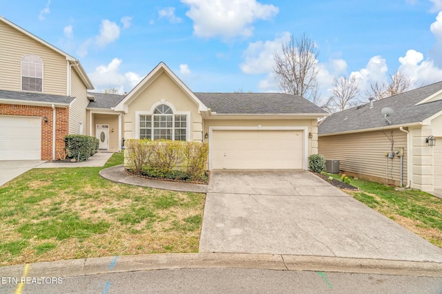 view of front of property featuring cooling unit, concrete driveway, stucco siding, a front lawn, and a garage