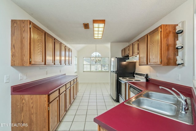 kitchen with light tile patterned floors, under cabinet range hood, electric stove, a sink, and a notable chandelier