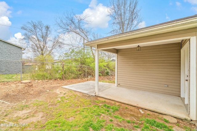 view of yard featuring a patio and fence