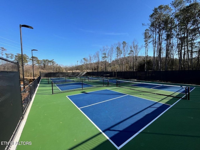 view of sport court featuring fence and community basketball court
