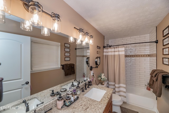 full bath with shower / tub combo with curtain, a textured ceiling, toilet, and vanity