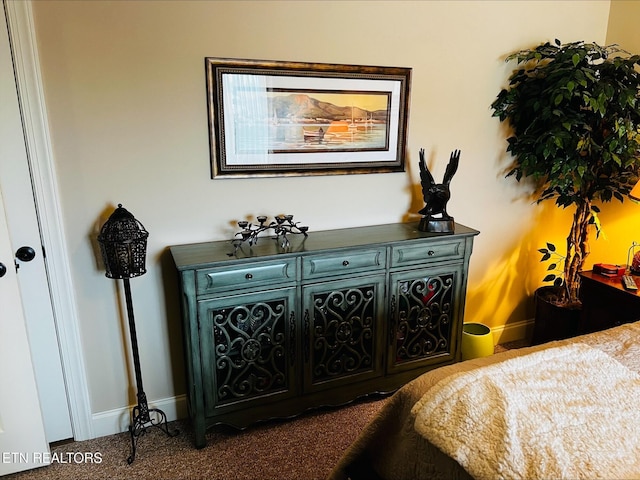 carpeted bedroom with baseboards