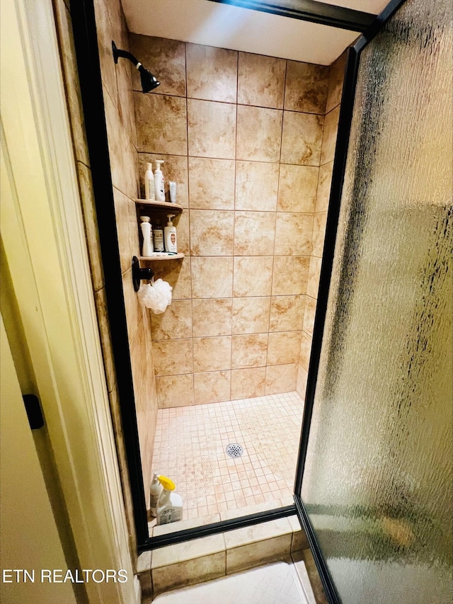bathroom featuring a stall shower