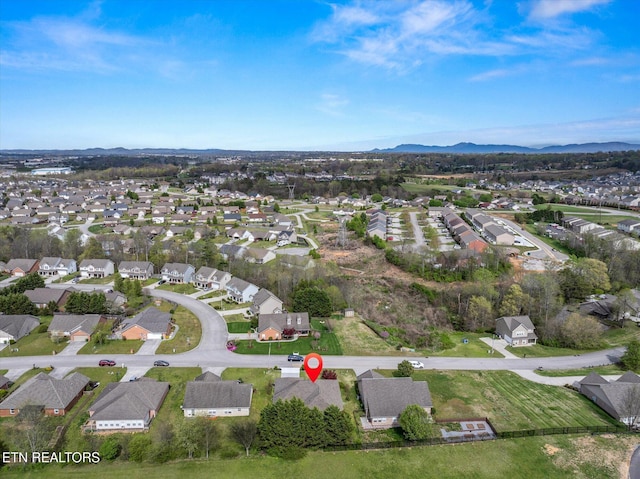 aerial view featuring a mountain view and a residential view