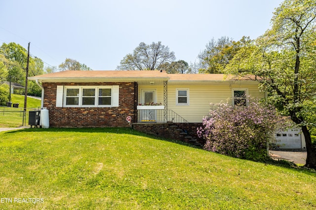 single story home with a front yard