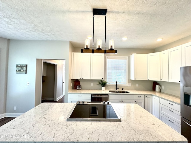 277 Deerfield Way, Lafollette, TN 37766 - kitchen with a sink, black electric stovetop, a textured ceiling, a center island, and dishwasher