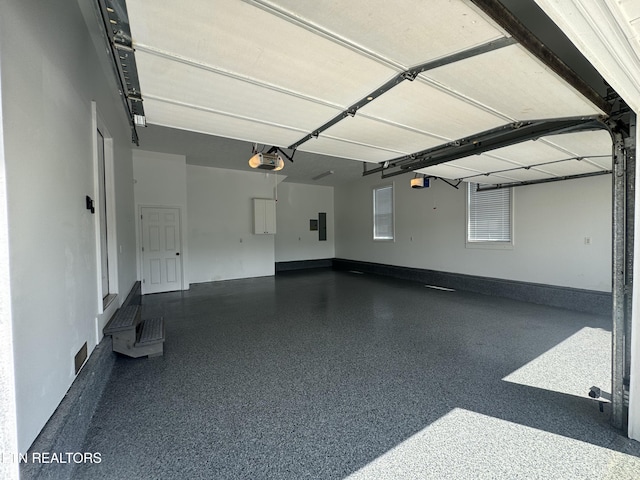277 Deerfield Way, Lafollette, TN 37766 - garage featuring a garage door opener and electric panel